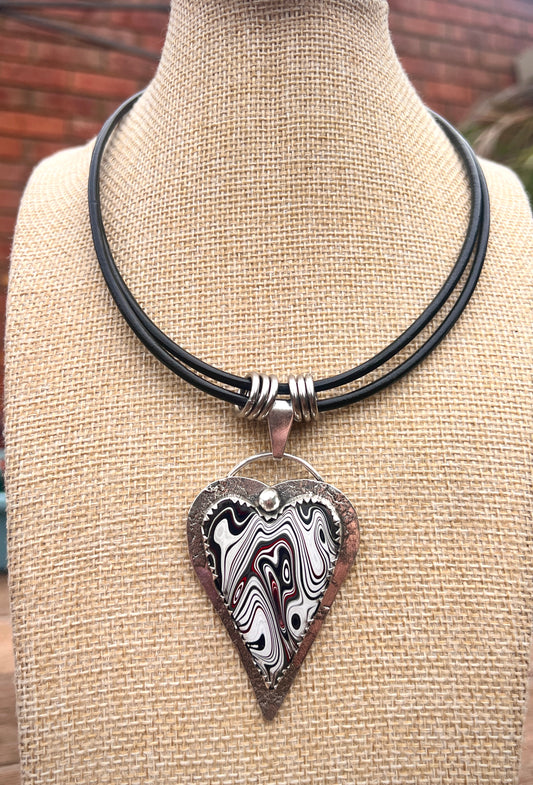 Fordite Pendant.