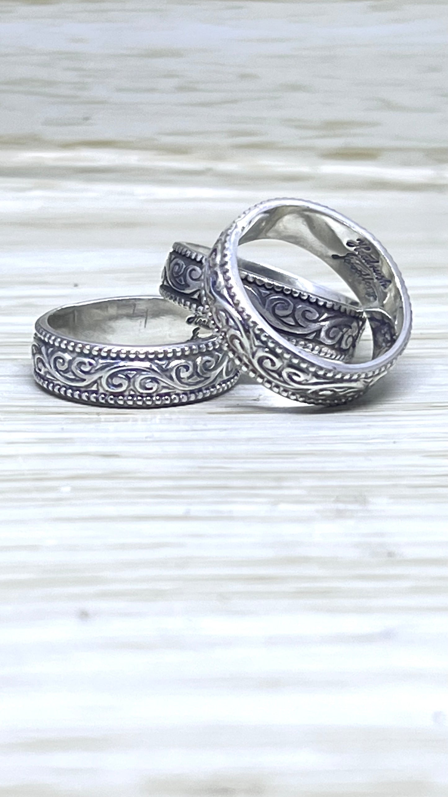 Assorted Silver Patterned Bands.