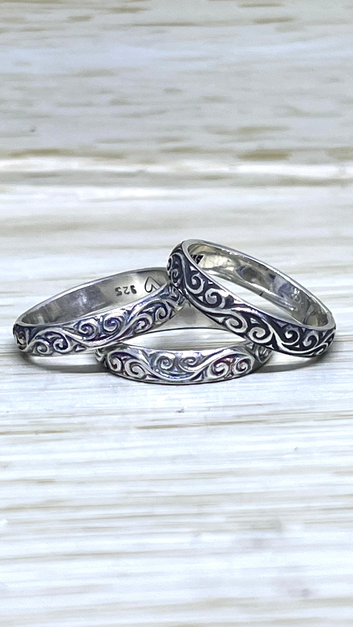 Assorted Silver Patterned Bands.