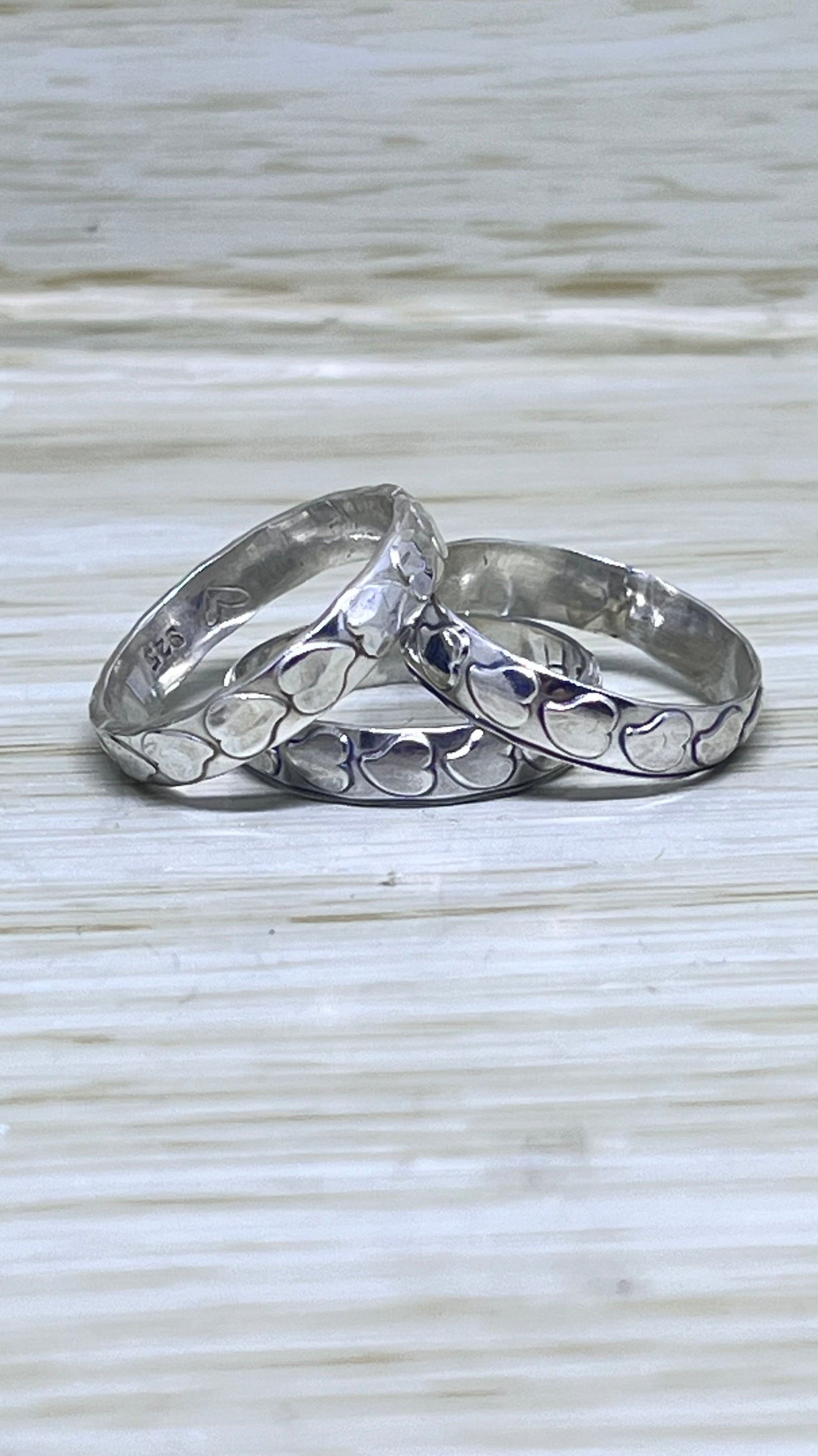 Assorted Silver Patterned Bands.